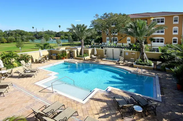 a view of a swimming pool with a patio