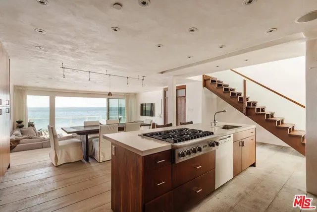 a kitchen with stainless steel appliances granite countertop a stove and a sink