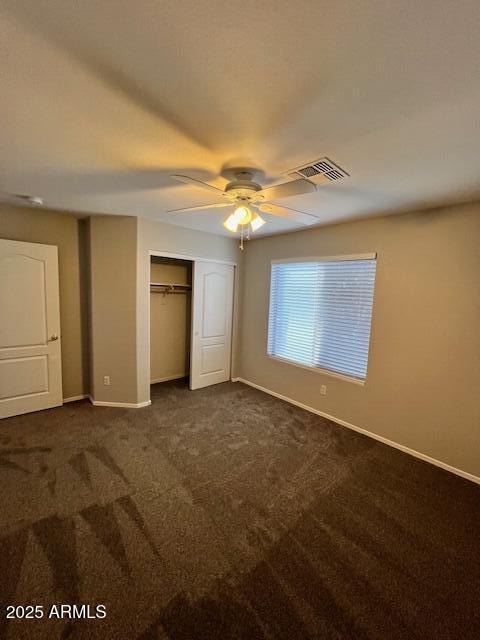 20582 North 92nd Lane Peoria, AZ 85382 - Photo 21 of 30 an empty room with a chandelier fan and windows