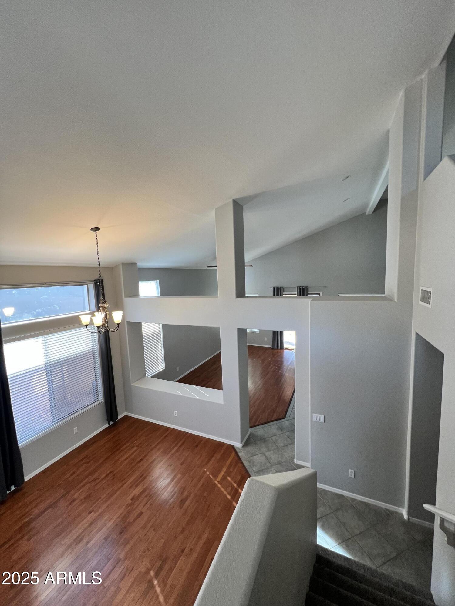 20582 North 92nd Lane Peoria, AZ 85382 - Photo 24 of 30 a view of a livingroom with furniture and wooden floor