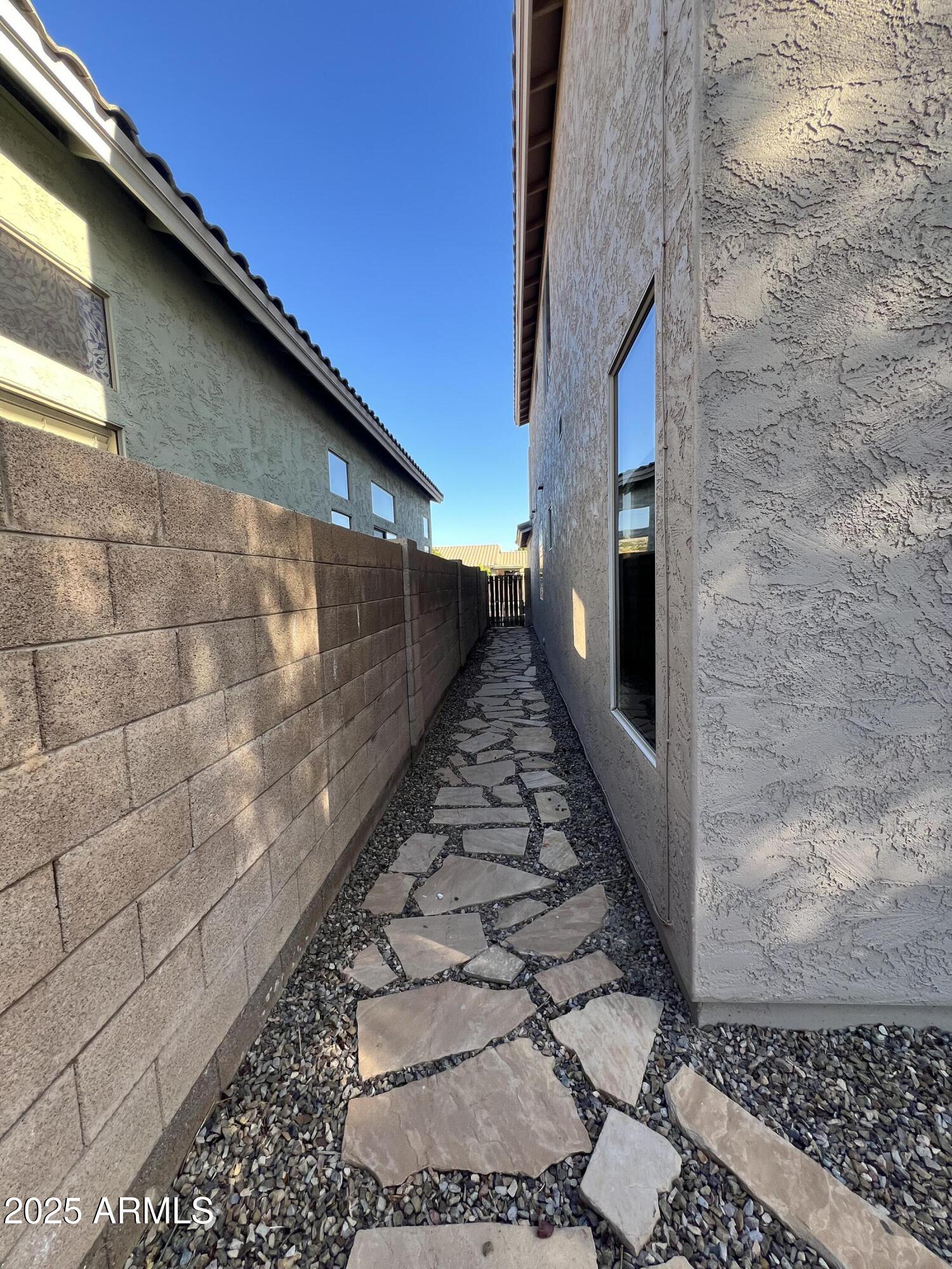 20582 North 92nd Lane Peoria, AZ 85382 - Photo 28 of 30 a view of a pathway both side of building