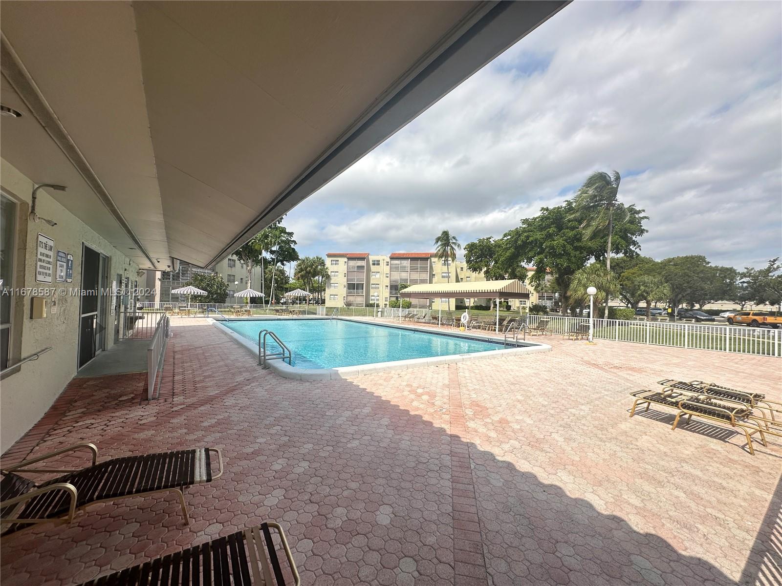 1820 Southwest 81st Avenue, Unit 3308 North Lauderdale, FL 33068 - Photo 11 of 49 a view of swimming pool from a balcony
