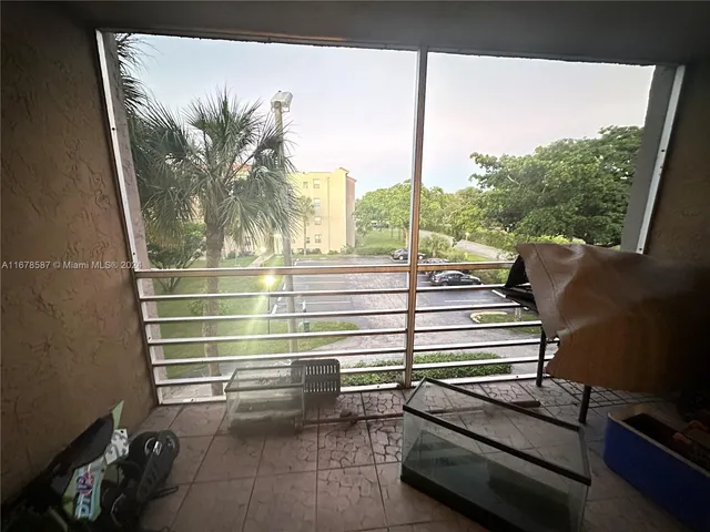 a view of a room with furniture and a window