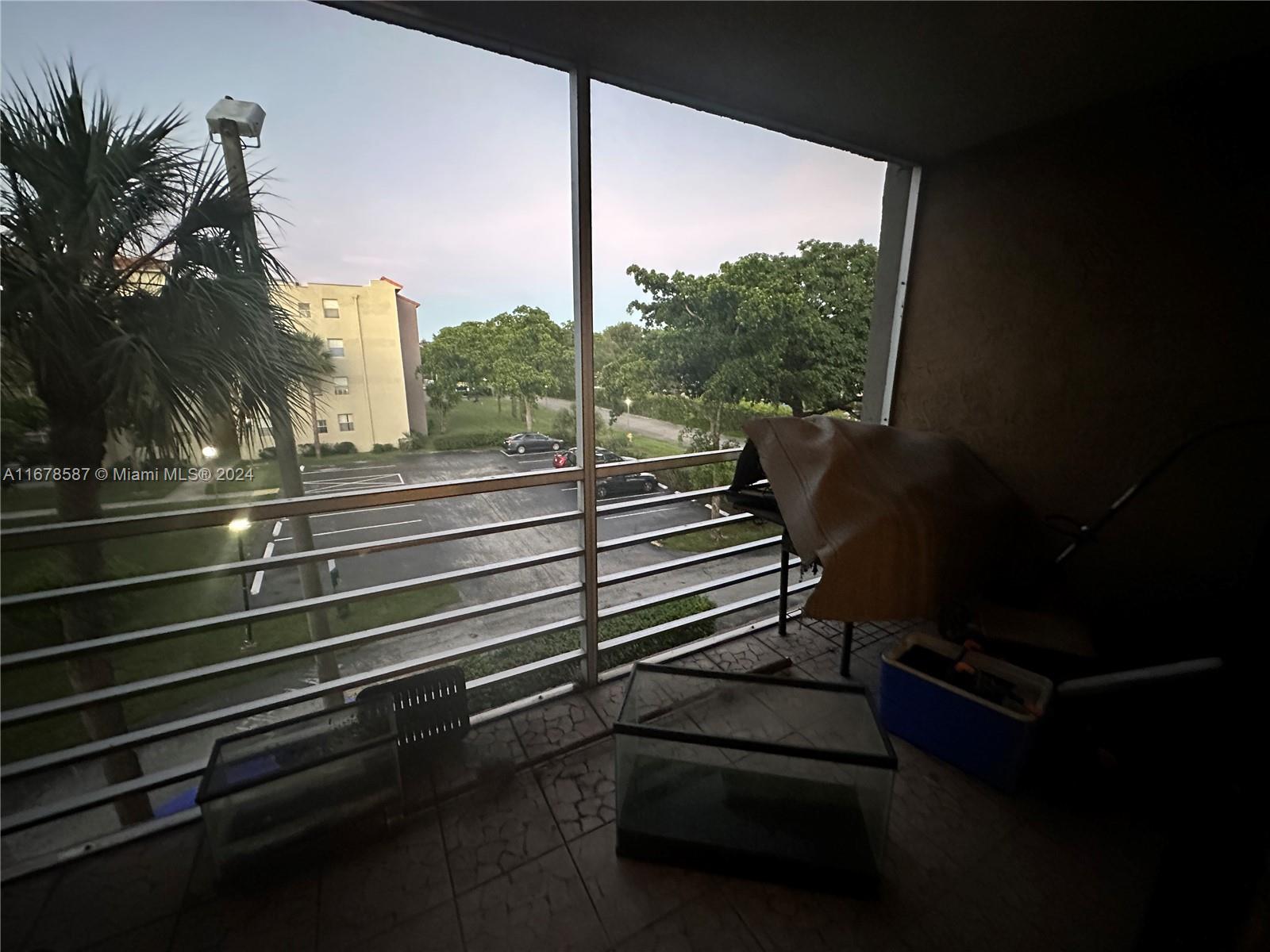 1820 Southwest 81st Avenue, Unit 3308 North Lauderdale, FL 33068 - Photo 15 of 49 a view of a balcony with chairs and wooden floor