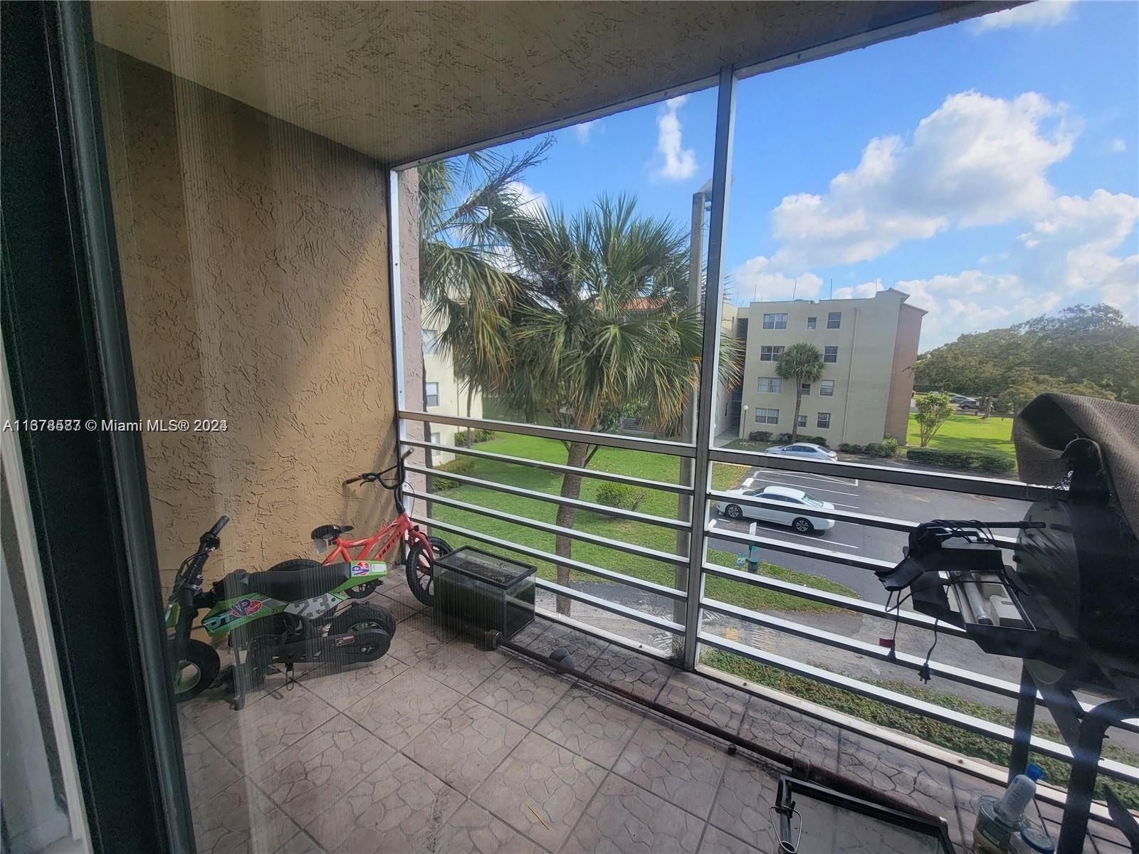 1820 Southwest 81st Avenue, Unit 3308 North Lauderdale, FL 33068 - Photo 31 of 49 a view of a porch with furniture and garden view
