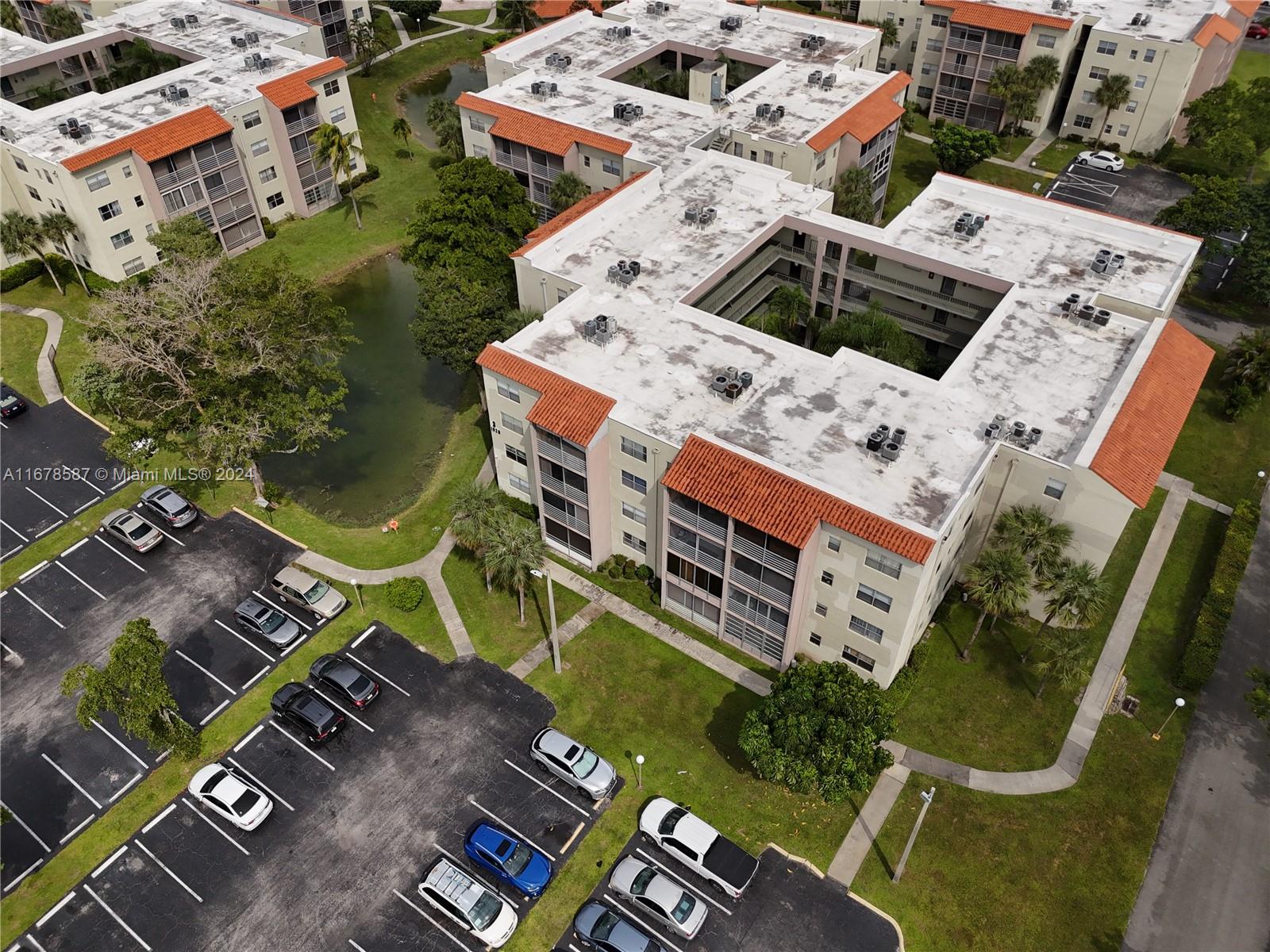 1820 Southwest 81st Avenue, Unit 3308 North Lauderdale, FL 33068 - Photo 5 of 49 an aerial view of residential house with outdoor space and parking