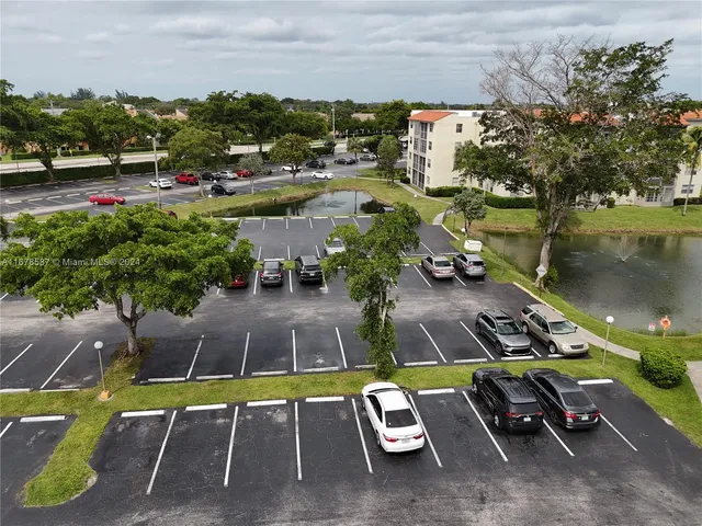 an aerial view of a house with a swimming pool outdoor seating and yard