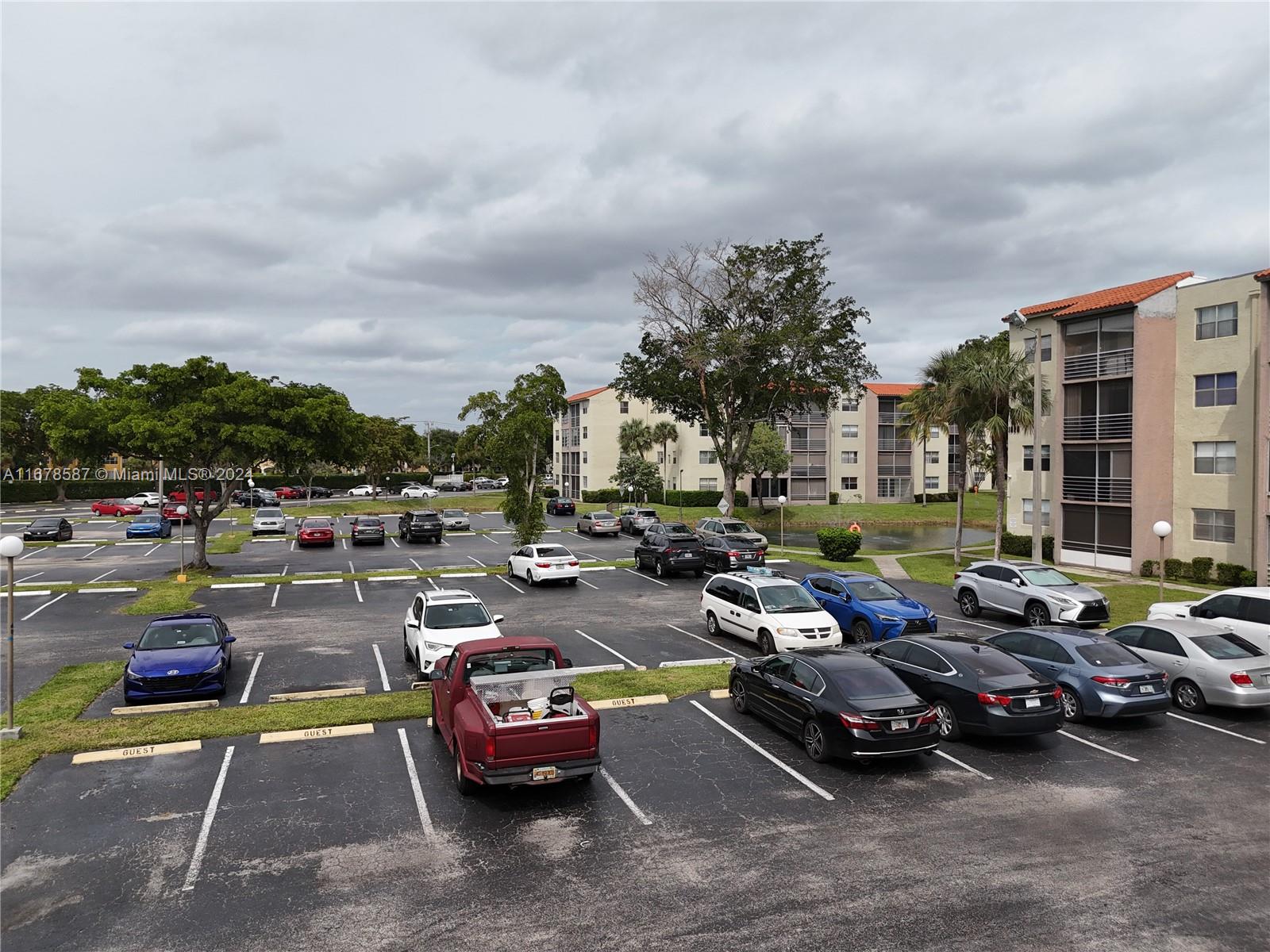 1820 Southwest 81st Avenue, Unit 3308 North Lauderdale, FL 33068 - Photo 10 of 49 a view of a street with cars