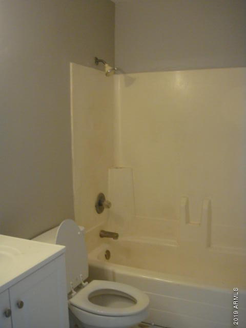 3315 West Loma Lane, Unit 4 Phoenix, AZ 85051 - Photo 10 of 13 a bathroom with a sink a toilet and shower