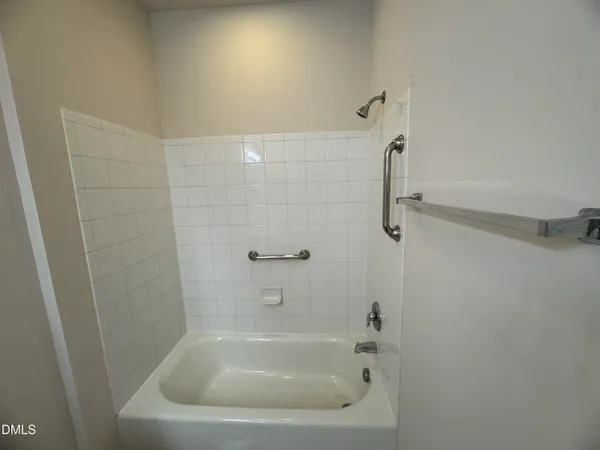 a close view of a bathtub in bathroom