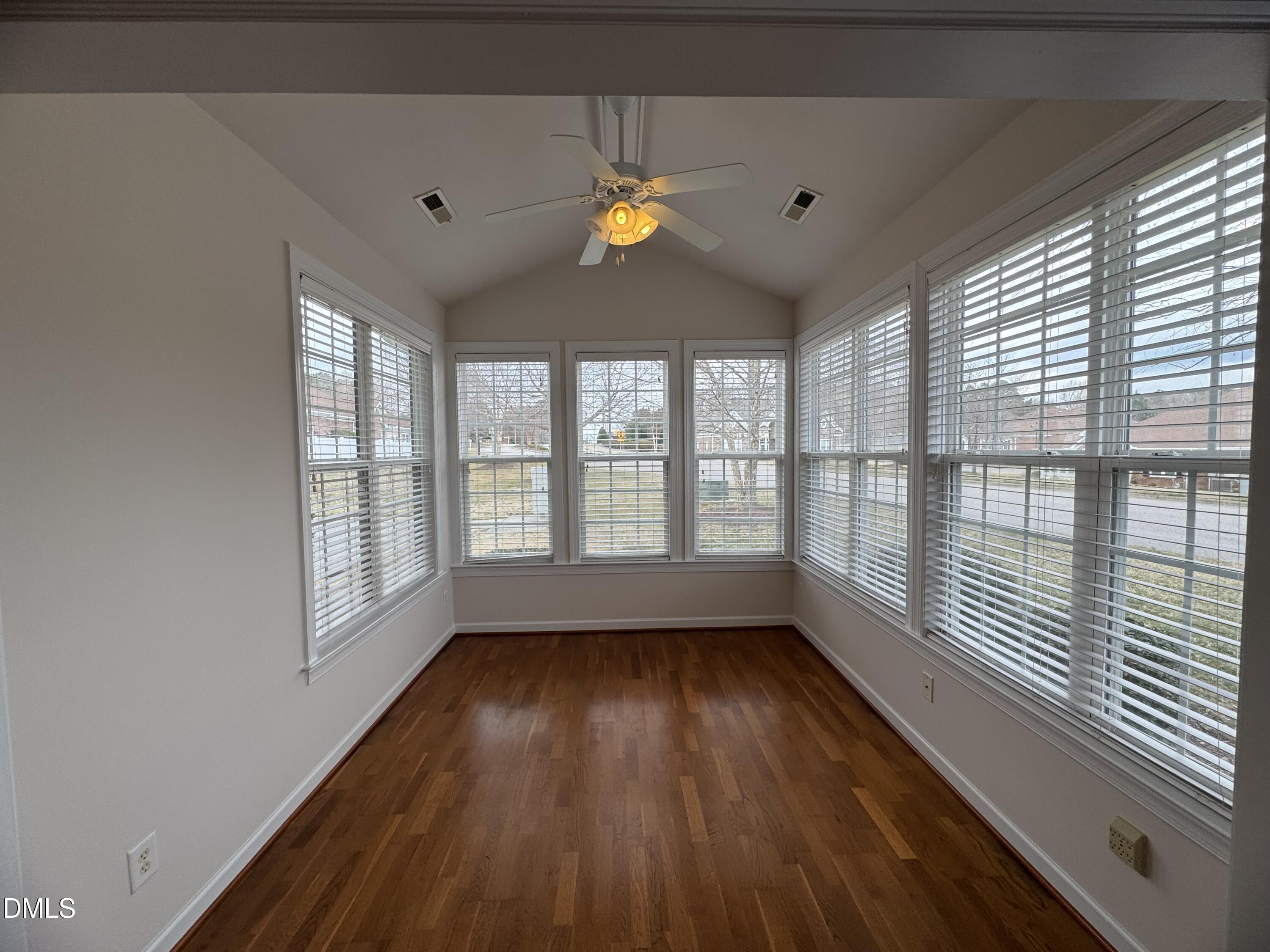 4622 Ivy Blossom Lane Raleigh, NC 27604 - Photo 4 of 15 a view of empty room with wooden floor and fan