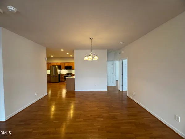 a view of a livingroom with a kitchen