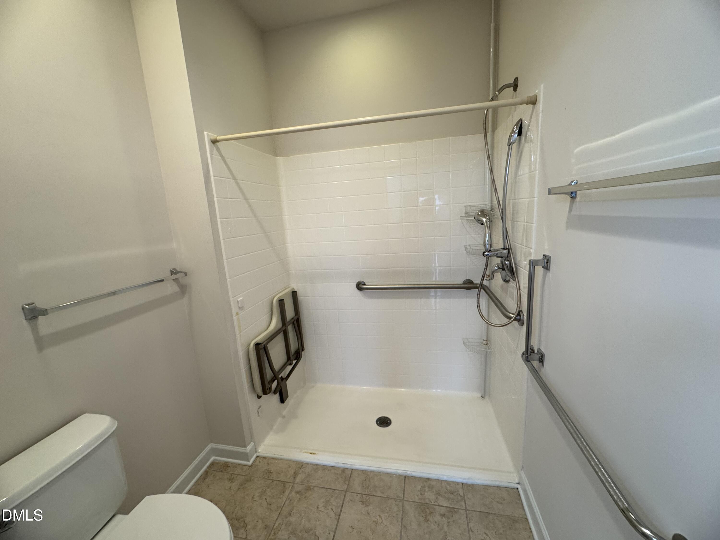 4622 Ivy Blossom Lane Raleigh, NC 27604 - Photo 10 of 15 a bathroom with a shower and toilet