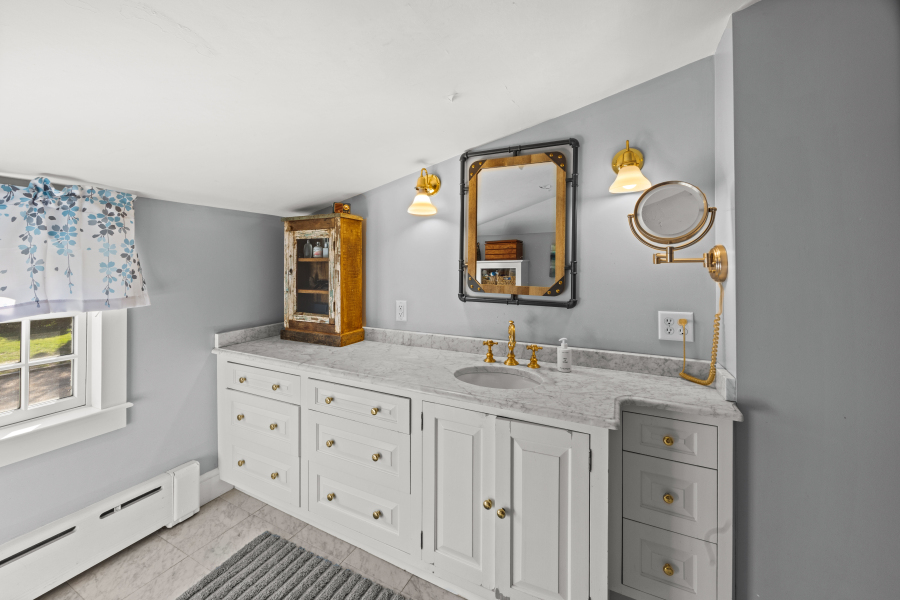 9 Fowler Avenue Edgartown, MA 02539 - Photo 18 of 27 a bathroom with a granite countertop double vanity sink and a mirror