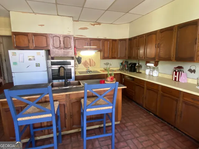 a view of a dining room with furniture and window