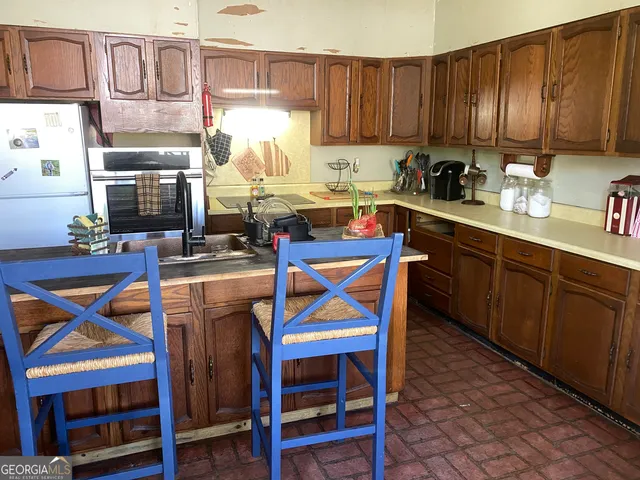 a view of a dining room with furniture and window