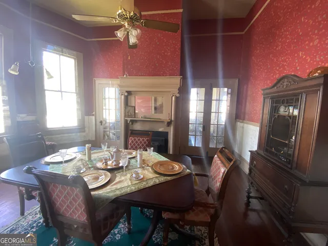 a bathroom with a sink toilet and shower curtain