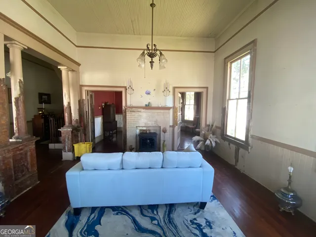 a bedroom with a bed and a mirror