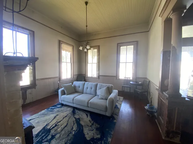 a bed sitting in a room next to a window