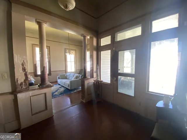 a bedroom with a bed and a mirror