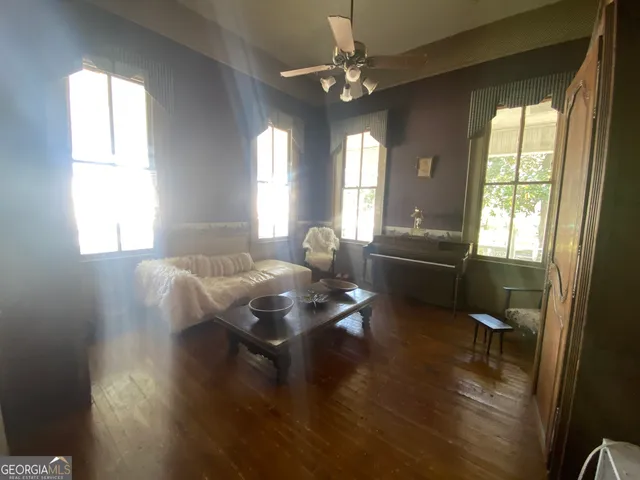 a swimming pool with trees in the background