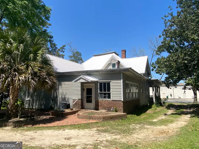 a view of entryway with furniture and wooden floor