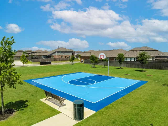 a view of an outdoor space and tennis court