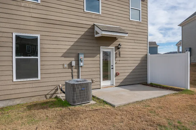 a view of a house with a yard and garage