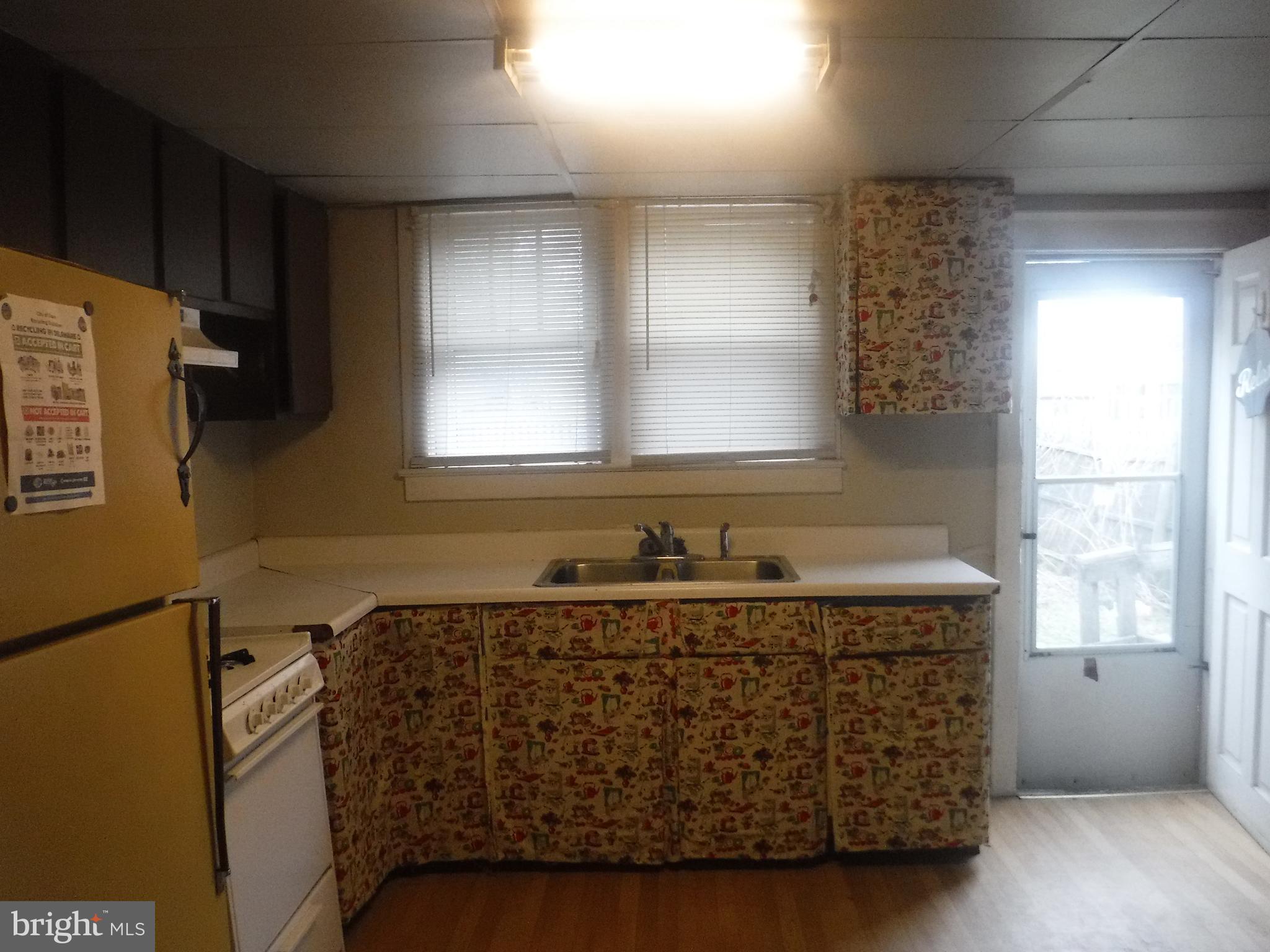 126 A North Dover, DE 19904 - Photo 4 of 6 a bathroom with a granite countertop sink a mirror and a bathtub