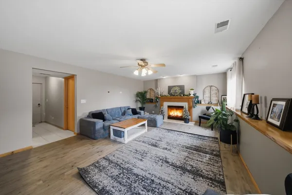 a living room with furniture and a fireplace