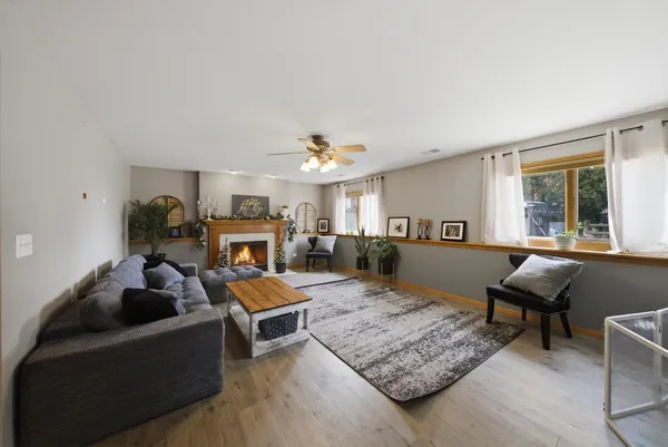 a living room with furniture and a fireplace