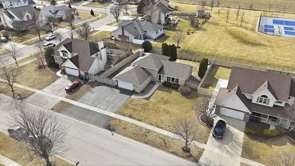 an aerial view of a house with a swimming pool