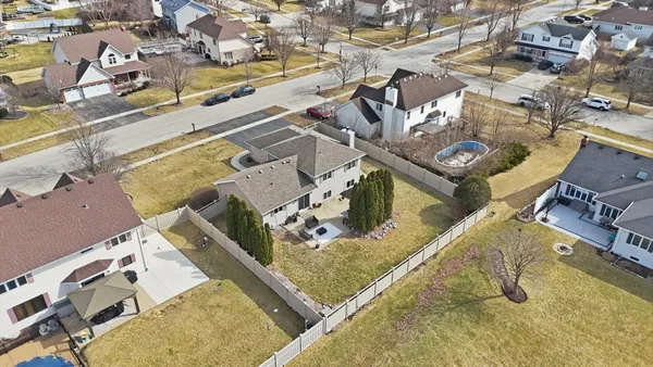 an aerial view of residential houses with outdoor space