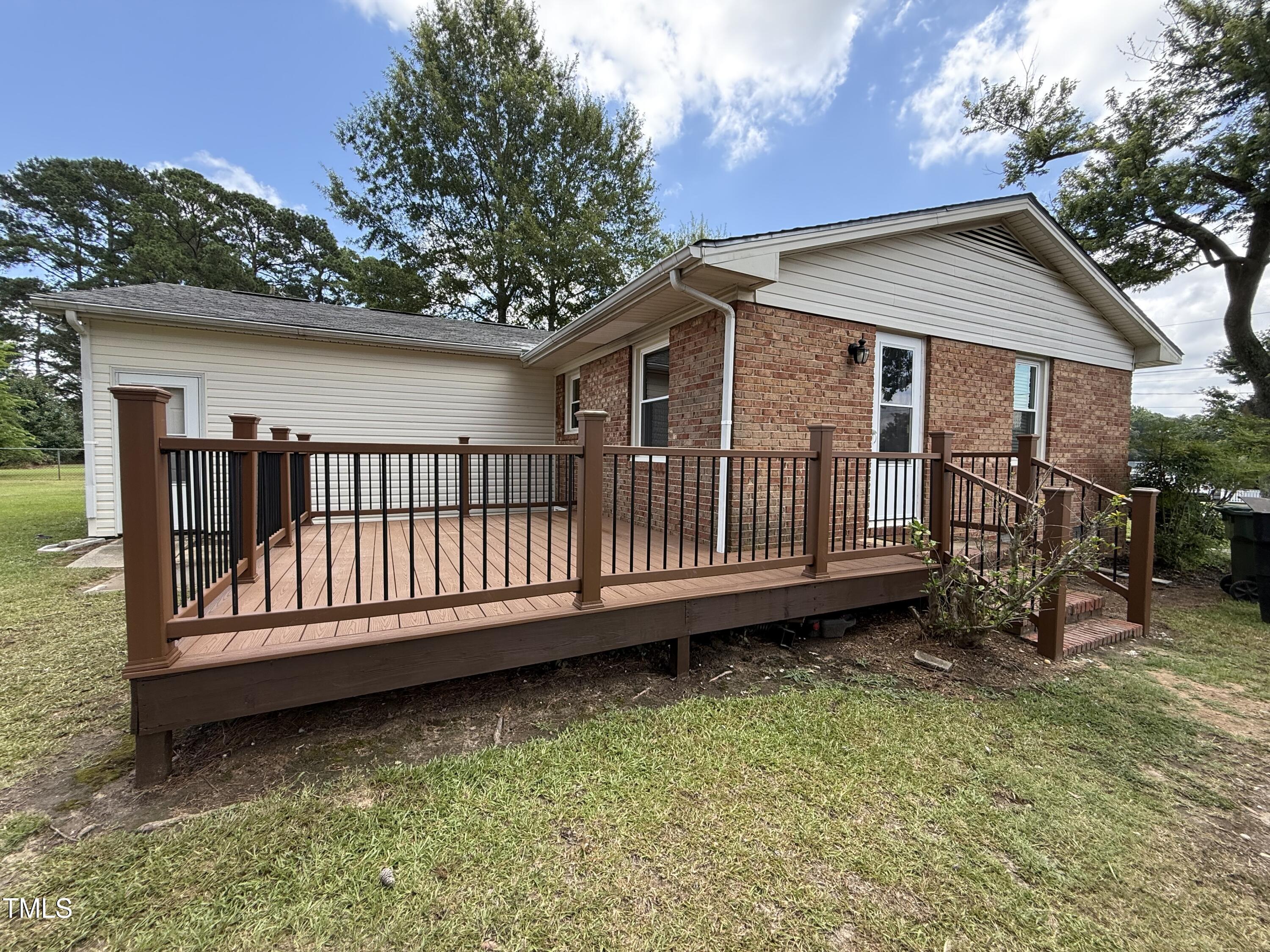 404 West A Street Erwin, NC 28339 - Photo 33 of 44 a view of a house with a wooden deck