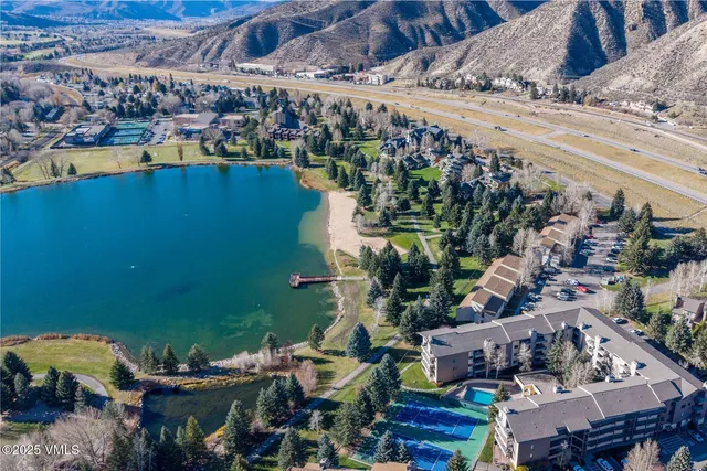 an aerial view of a house with a ocean view