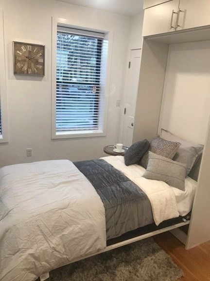 16 5th Street, Unit 31 Chelsea, MA 02150 - Photo 12 of 25 a bedroom with a bed and a window