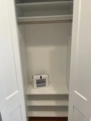 a bathroom with a shower and a toilet