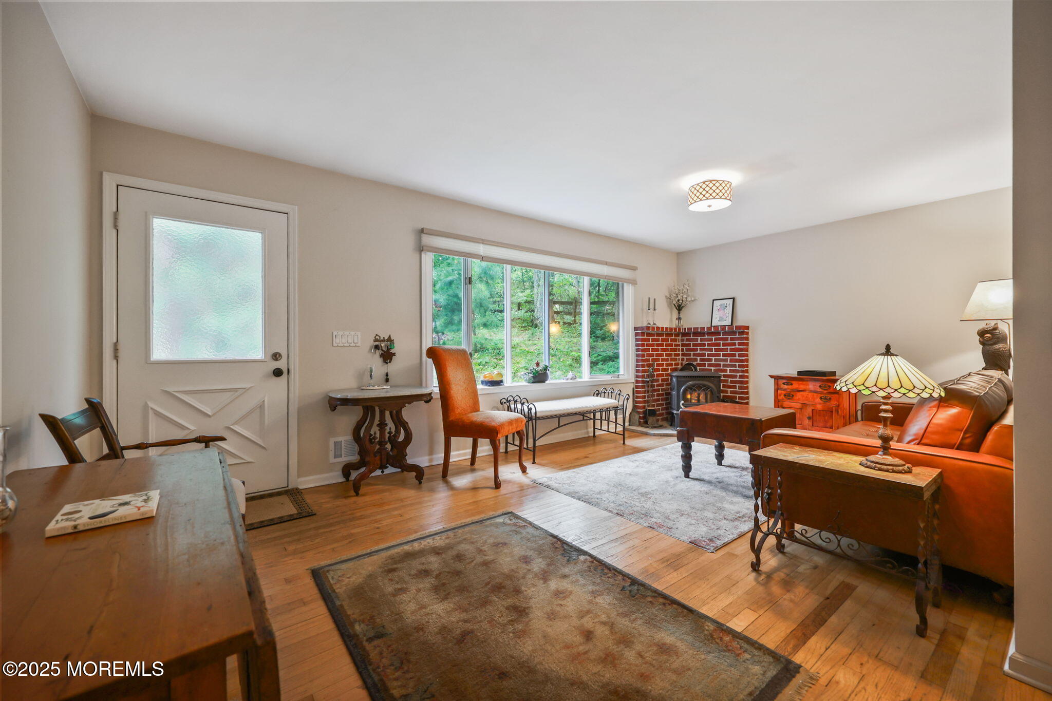 724 South Riverside Drive Neptune Township, NJ 07753 - Photo 11 of 39 a living room with furniture and a window