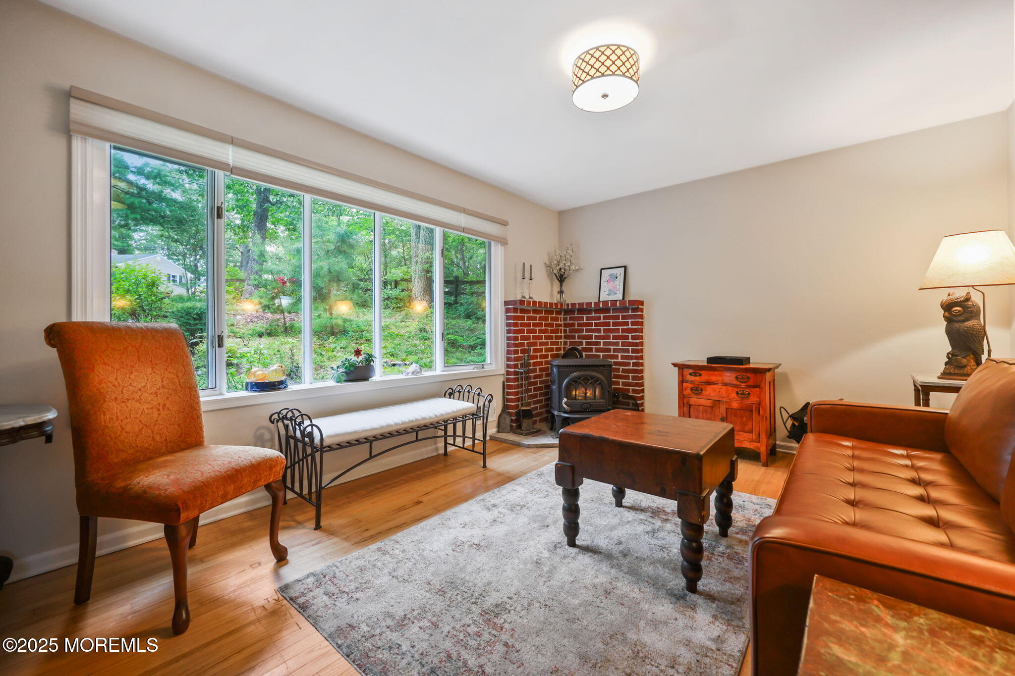 724 South Riverside Drive Neptune Township, NJ 07753 - Photo 12 of 39 a living room with furniture and a fireplace