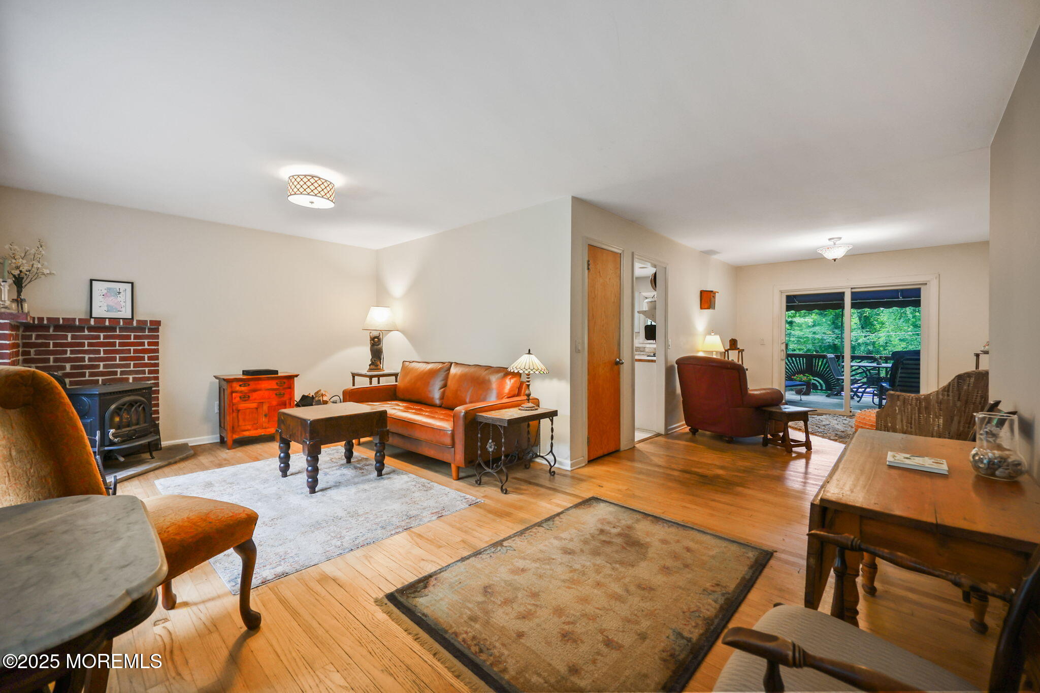 724 South Riverside Drive Neptune Township, NJ 07753 - Photo 13 of 39 a living room with furniture fireplace and a table