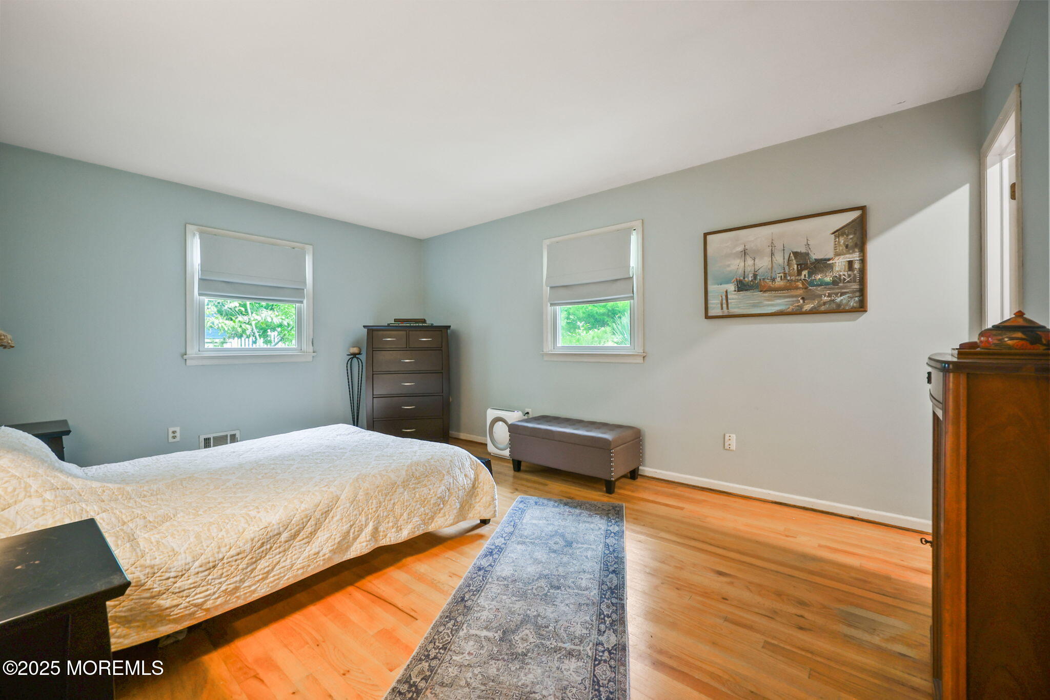 724 South Riverside Drive Neptune Township, NJ 07753 - Photo 16 of 39 a bedroom with a bed and a couch