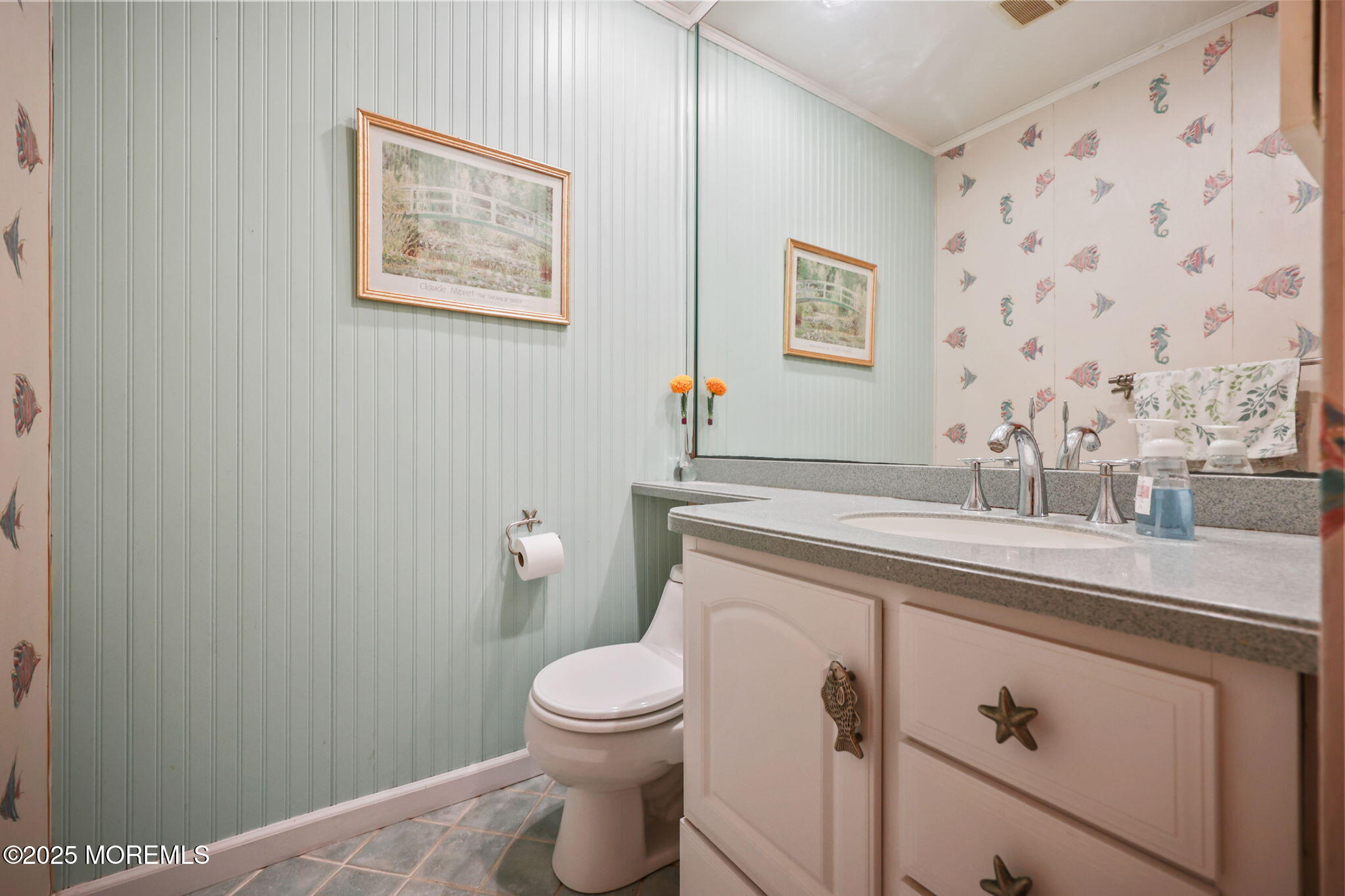 724 South Riverside Drive Neptune Township, NJ 07753 - Photo 22 of 39 a bathroom with a sink a toilet and a mirror