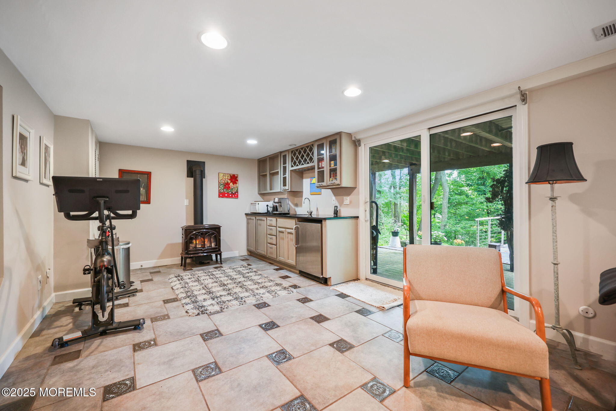 724 South Riverside Drive Neptune Township, NJ 07753 - Photo 25 of 39 a living room with furniture a window and gym equipment
