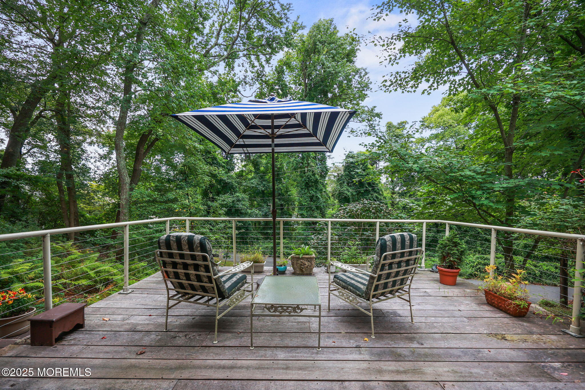 724 South Riverside Drive Neptune Township, NJ 07753 - Photo 31 of 39 a view of a roof deck with couch and wooden floor