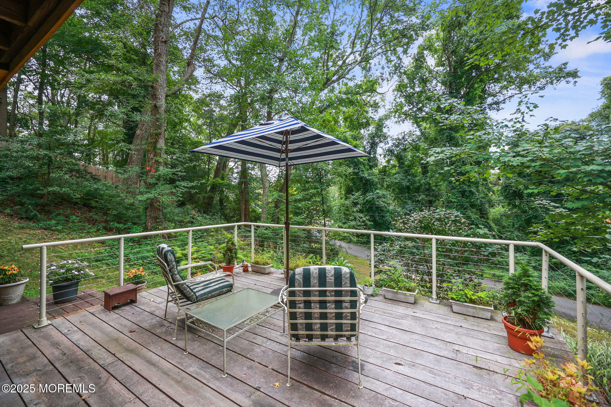 724 South Riverside Drive Neptune Township, NJ 07753 - Photo 32 of 39 a terrace view with sitting space and trees