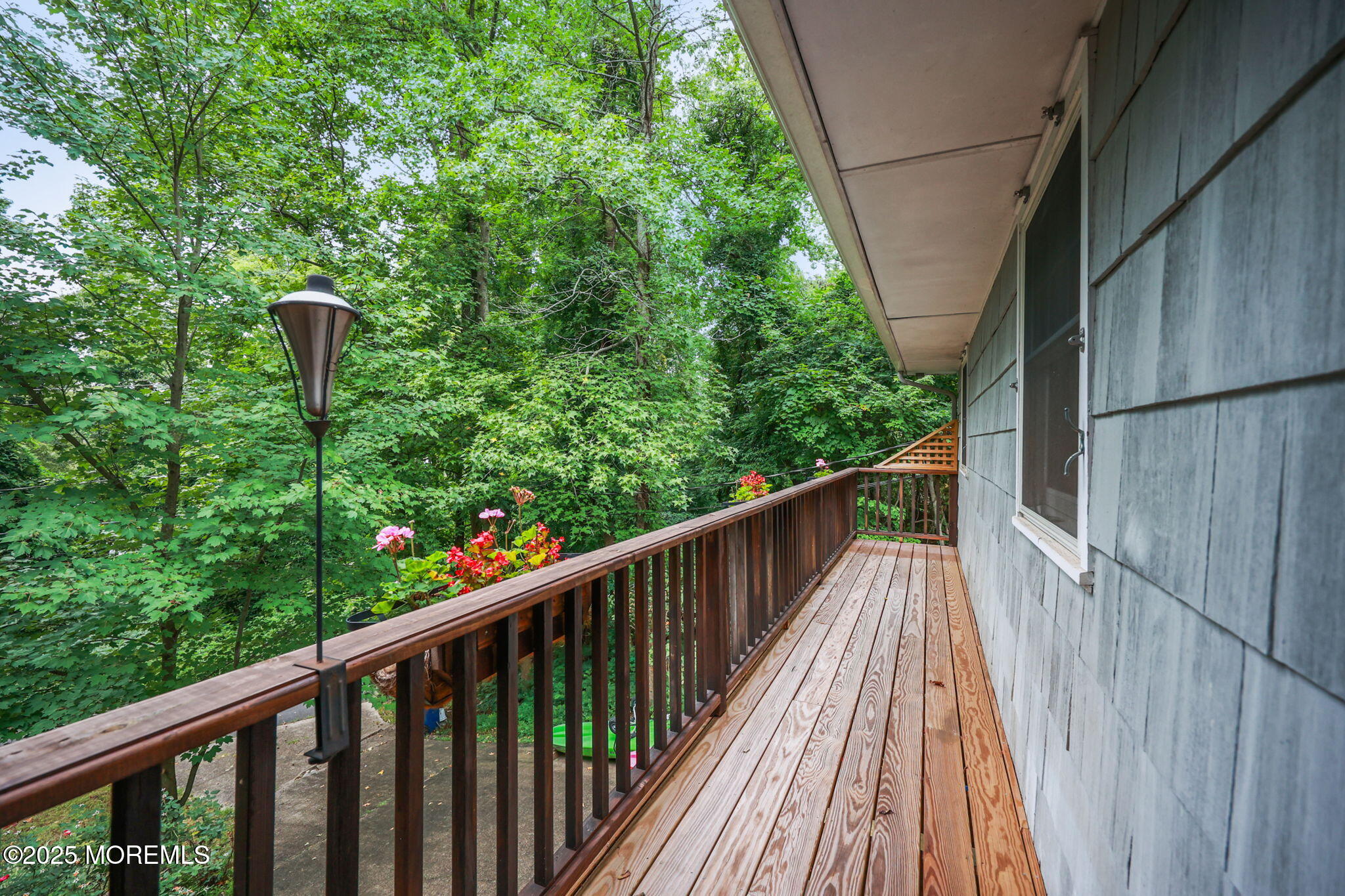 724 South Riverside Drive Neptune Township, NJ 07753 - Photo 38 of 39 a balcony with wooden floor in front of it