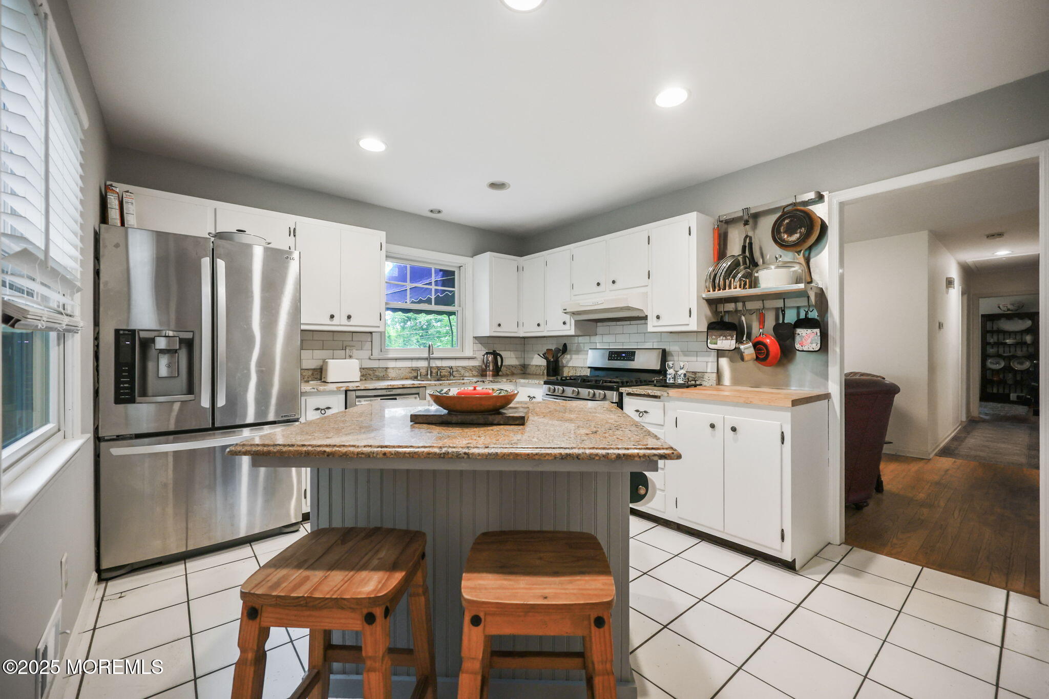 724 South Riverside Drive Neptune Township, NJ 07753 - Photo 8 of 39 a kitchen with stainless steel appliances granite countertop a refrigerator and a stove top oven
