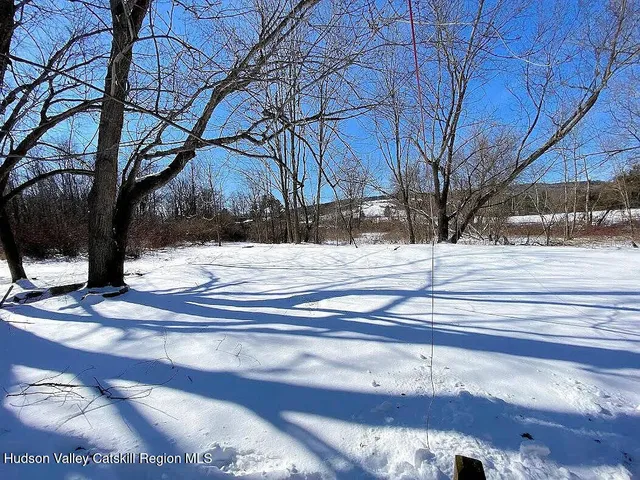 a view of a yard covered with snow