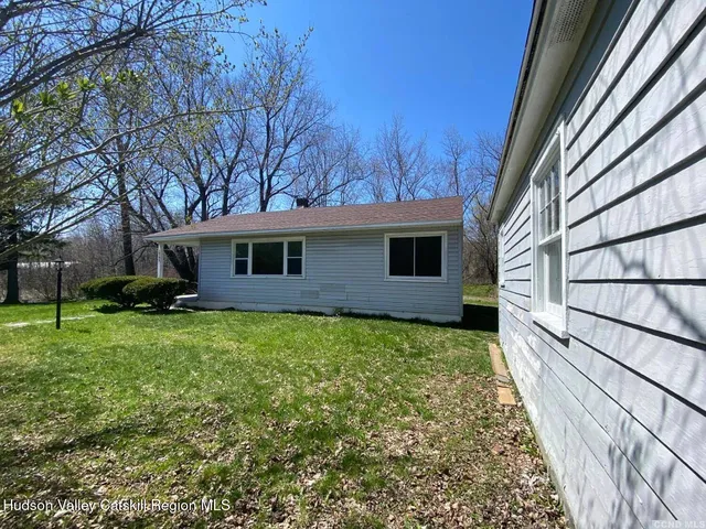 a backyard of a house with lots of green space