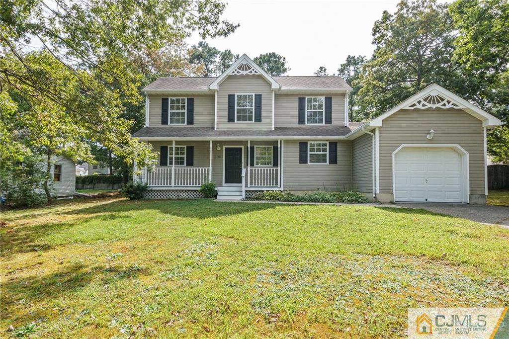 149 Brigantine Road Manahawkin, NJ 08050 - Photo 1 of 29 a front view of a house with a yard